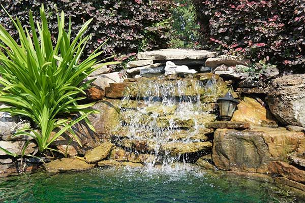 waterfall and spa construction with natural stone design